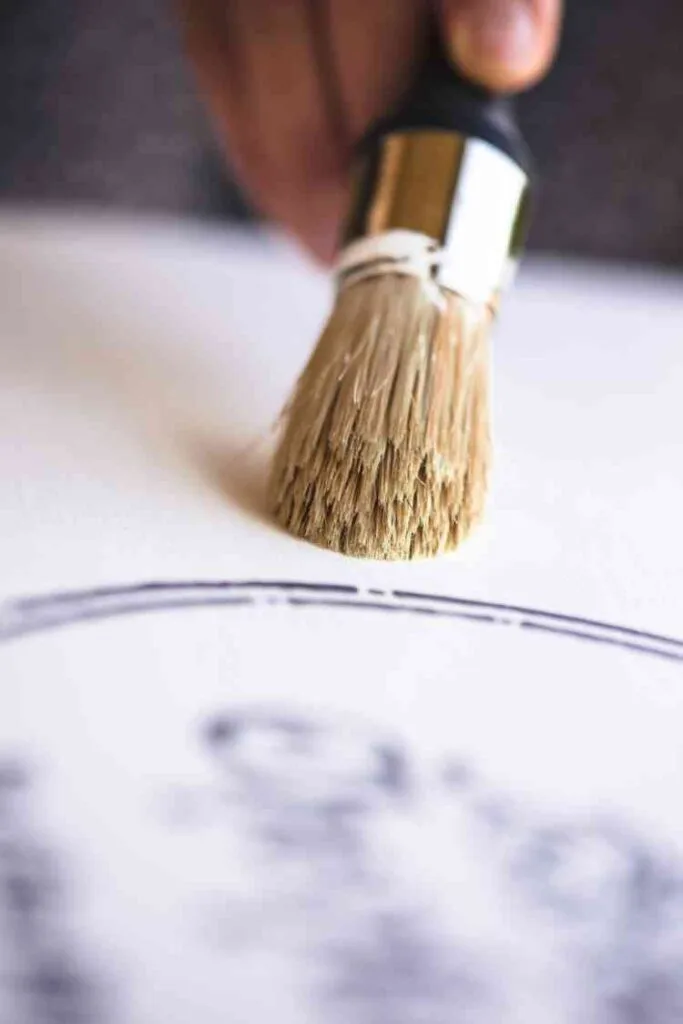 applying wax to a chalk painted table