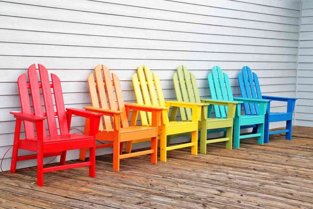 Colorful wooden chairs on a wooden floor