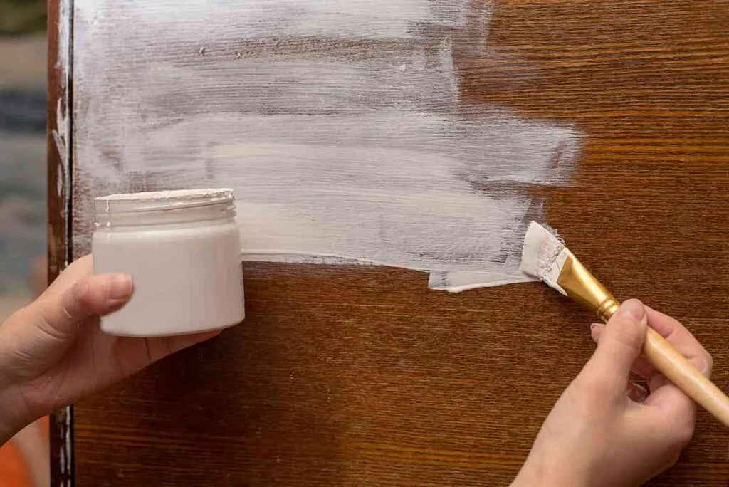 Restoring a piece of wood furniture with white chalk paint