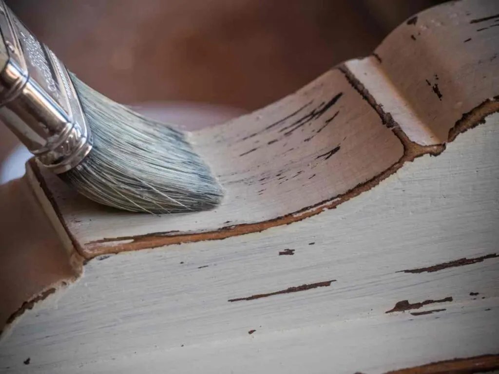 Using a paintbrush for how to seal painted furniture