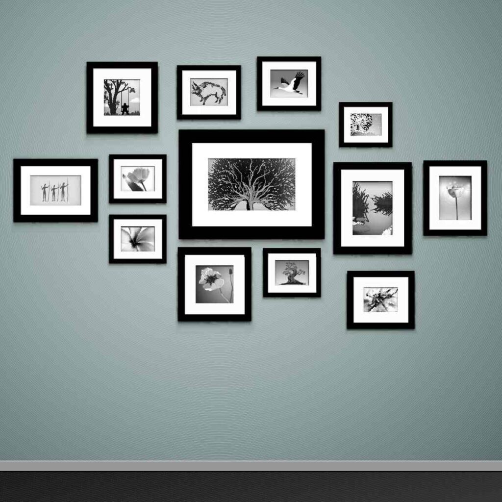 Gallery photo wall created with black and white photos in various size frames