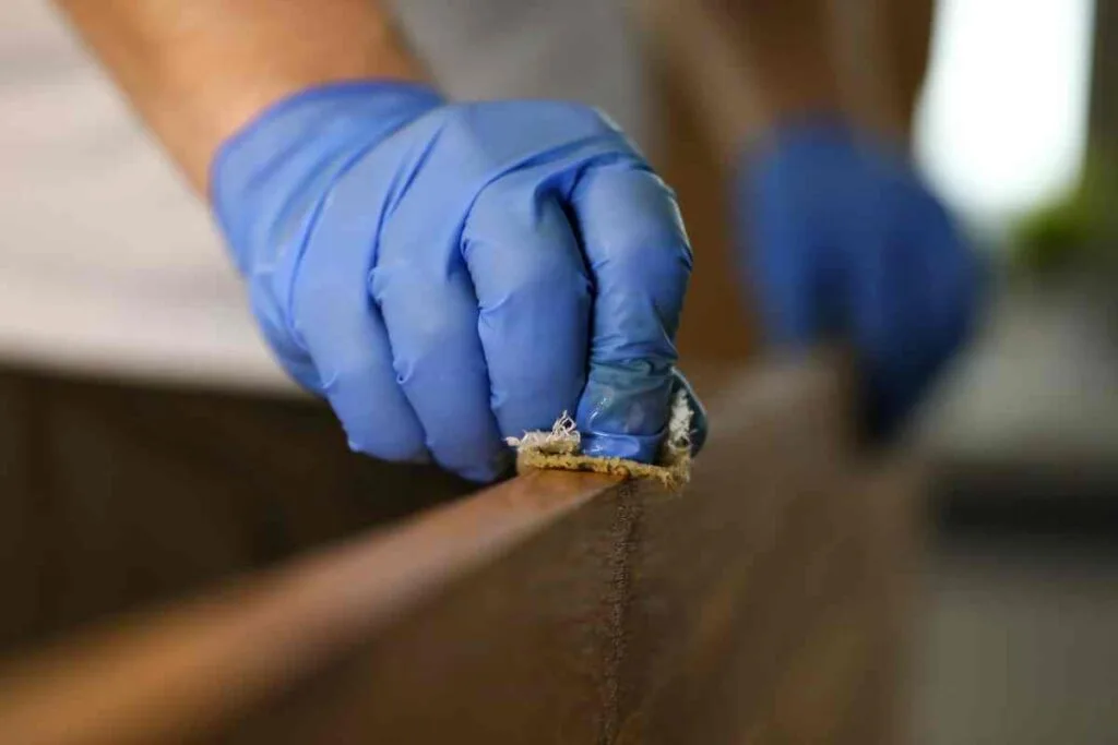 Removing varnish from furniture with a rag
