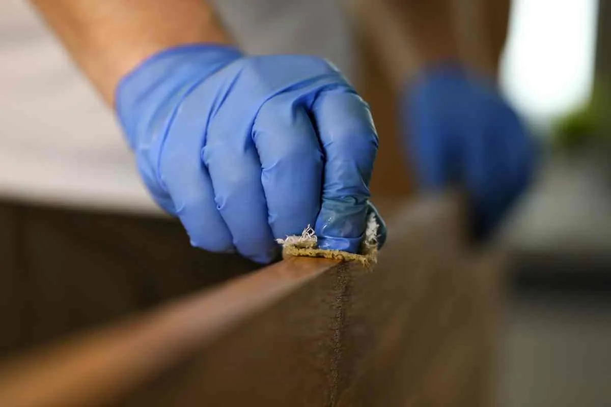 Removing varnish from furniture with a rag