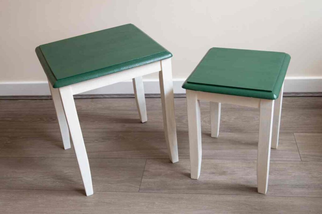 Two side tables painted green with white legs