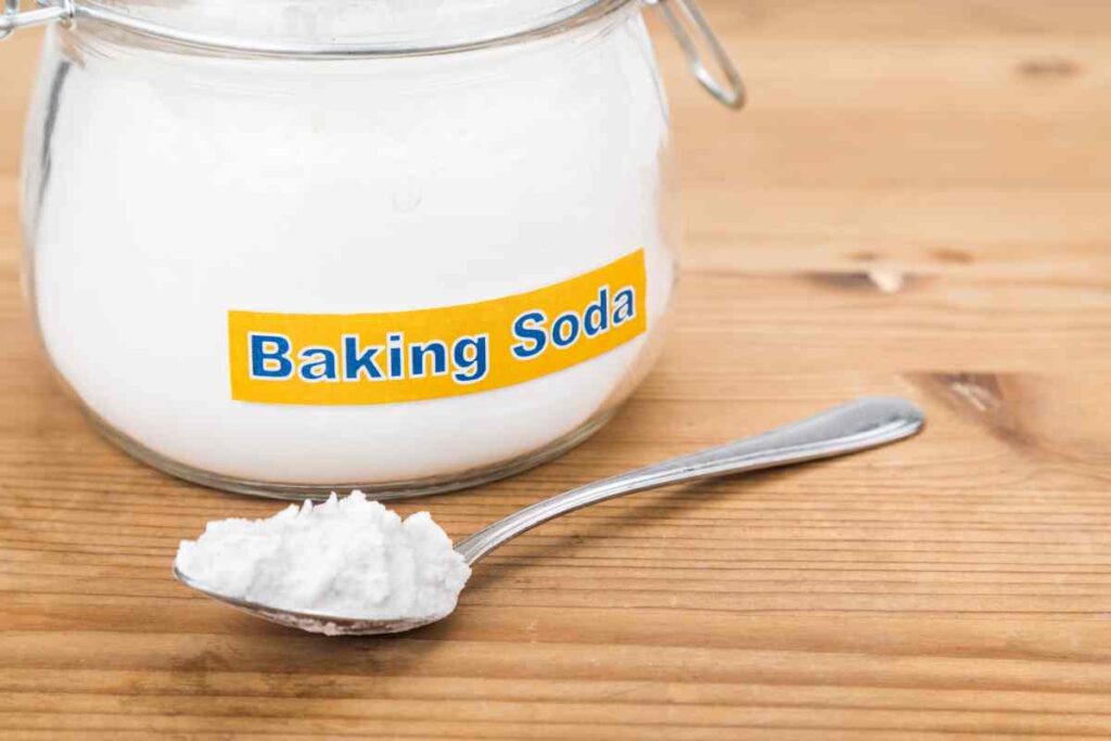 jar of baking soda and a spoon