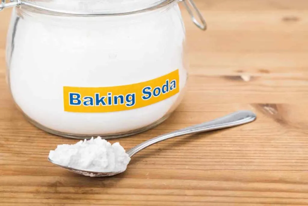 jar of baking soda and a spoon