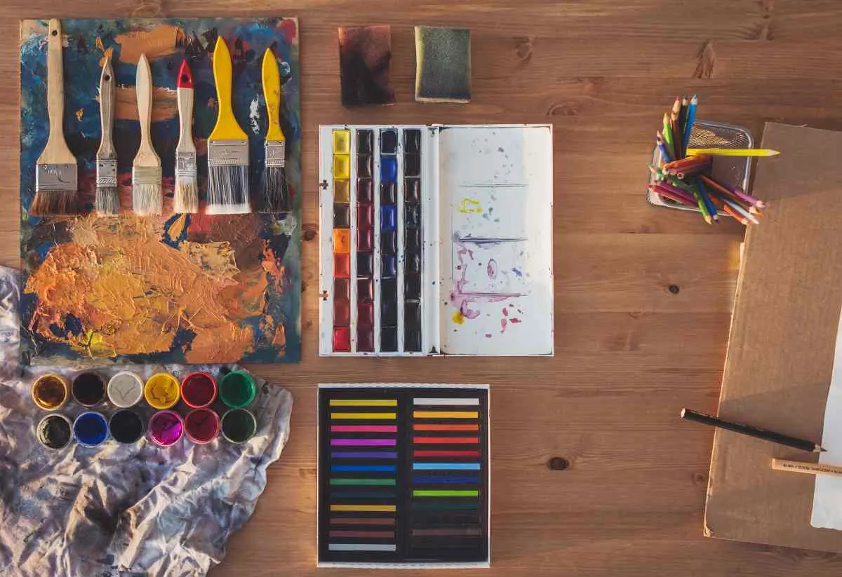 Painting supplies laid out for painted table top ideas