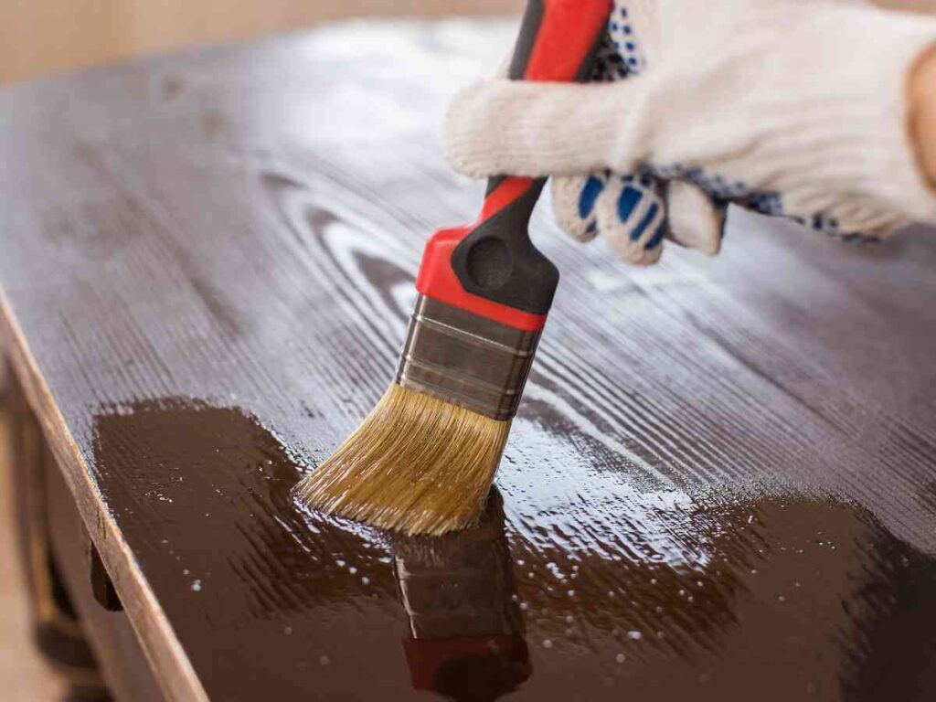 Applying sealant to a painted table