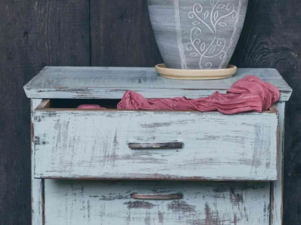 small white distressed finish dresser