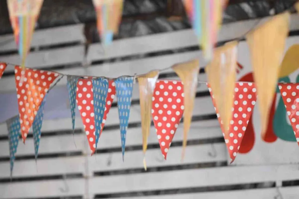 colorful paper cut into triangle shapes and made into a garland