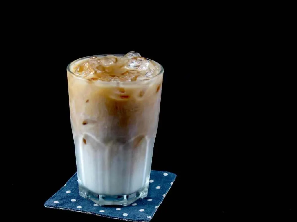 Iced coffee on coaster with dot pattern