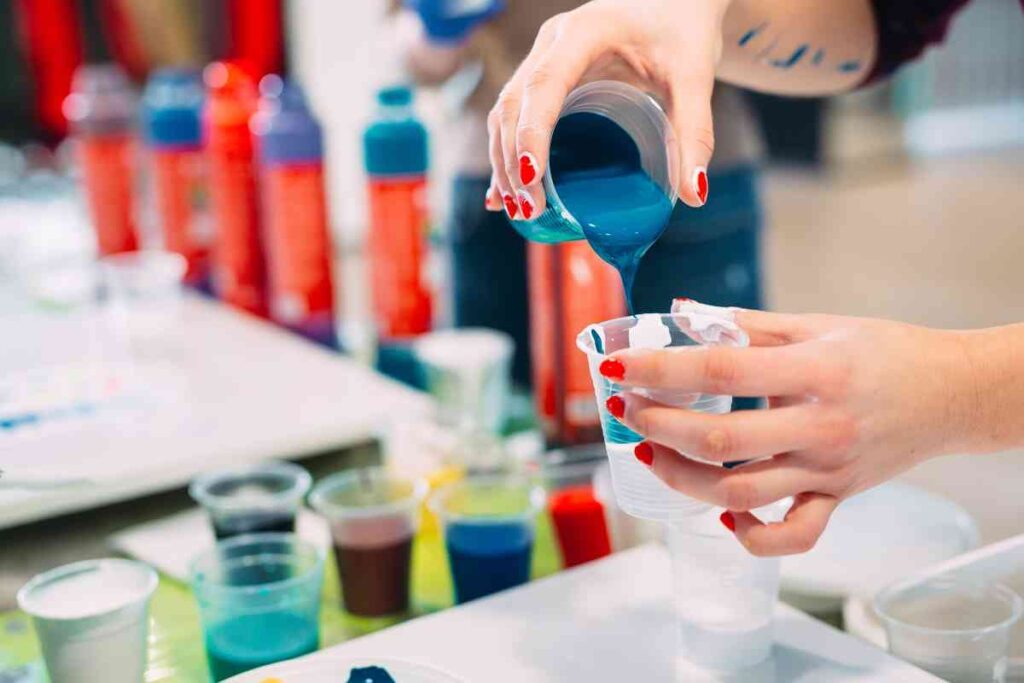 Layering colors in a cup for acrylic paint pouring