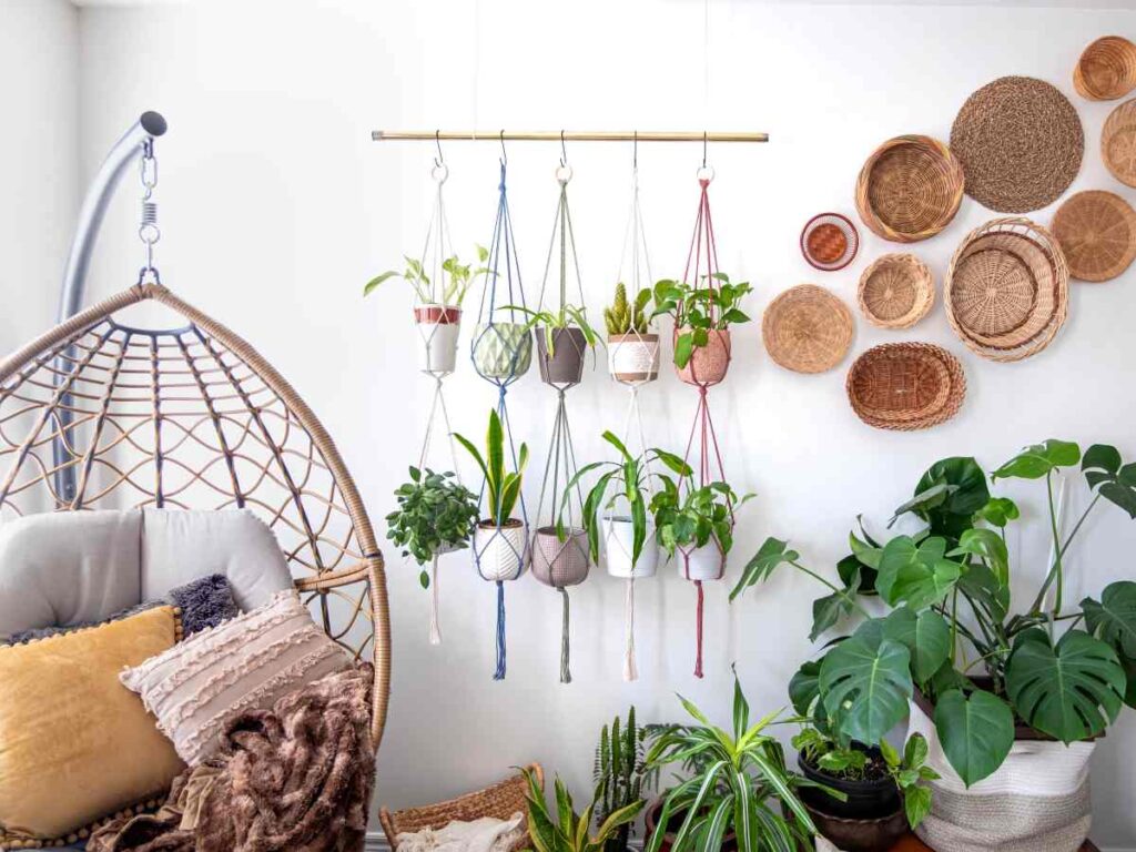 Room decorated with macrame plant hangers, baskets, and plants