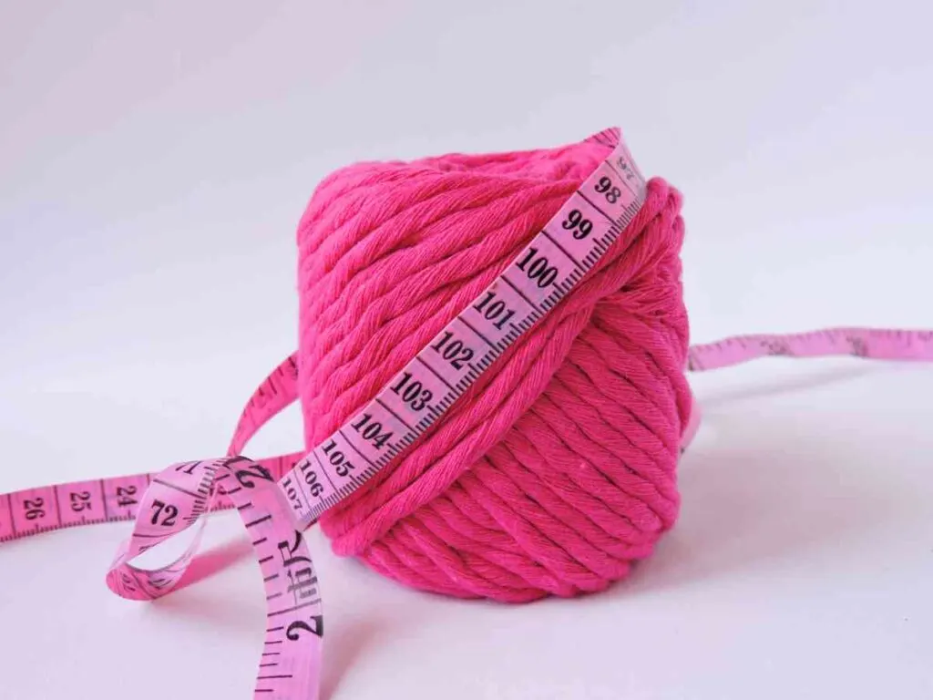 Pink macrame cord with a measuring tape