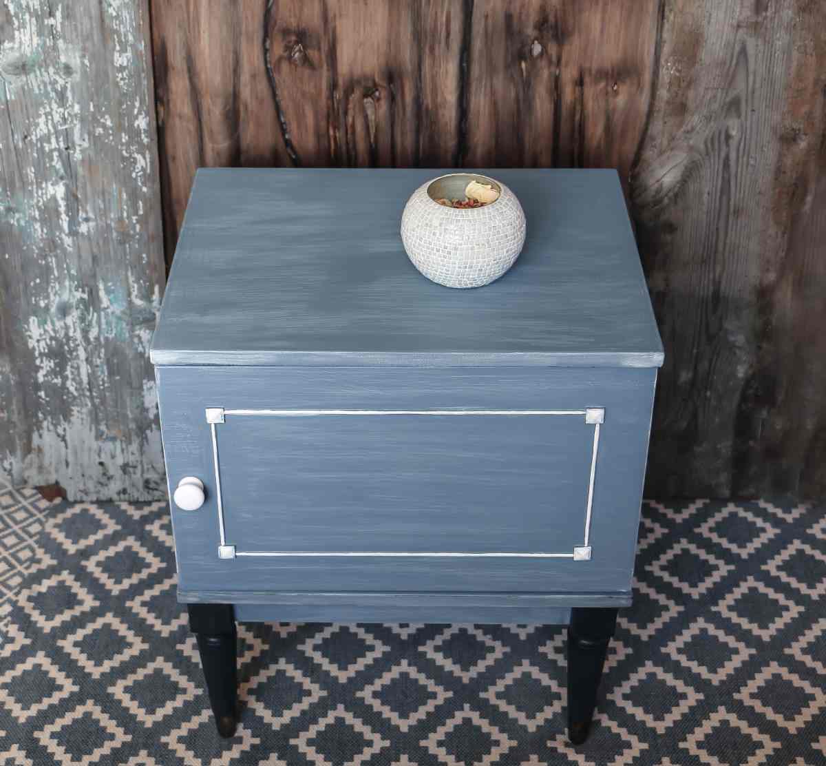 Small vintage dresser painted blue using dry brushing paint technique