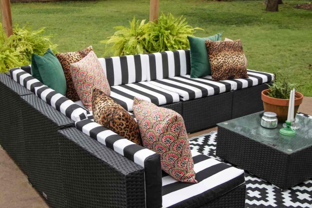 Black wicker patio furniture with pillows
