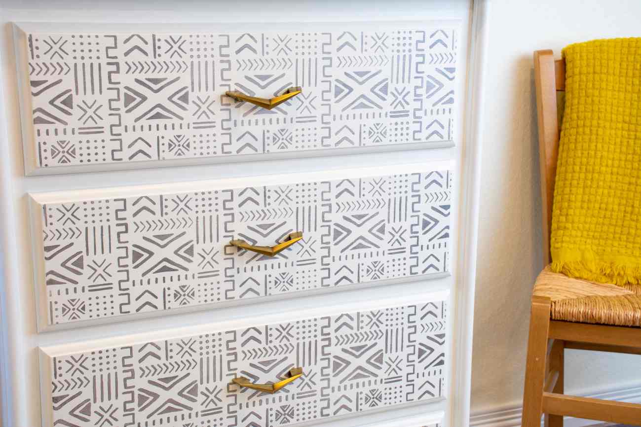 White dresser updated with grey furniture stencils