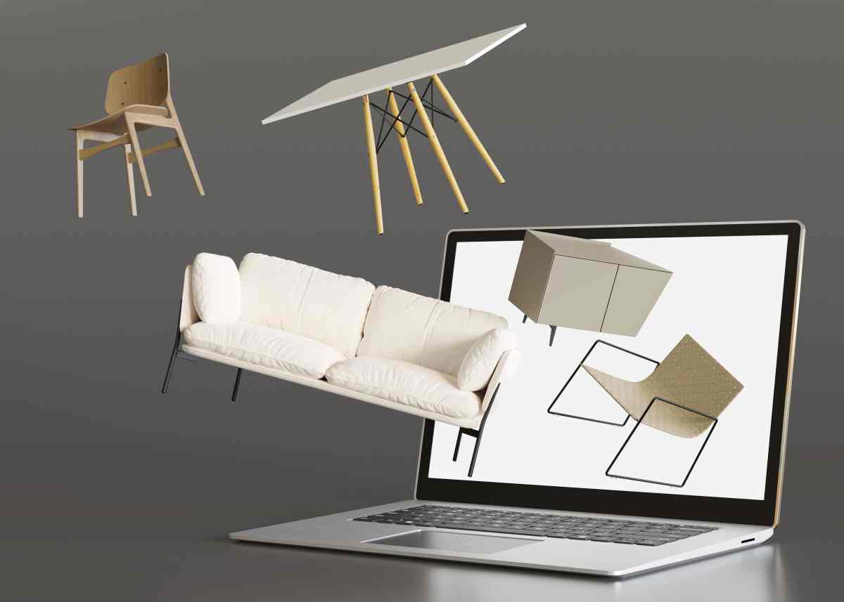 Furniture flying out of a laptop showing how easy selling furniture online can be