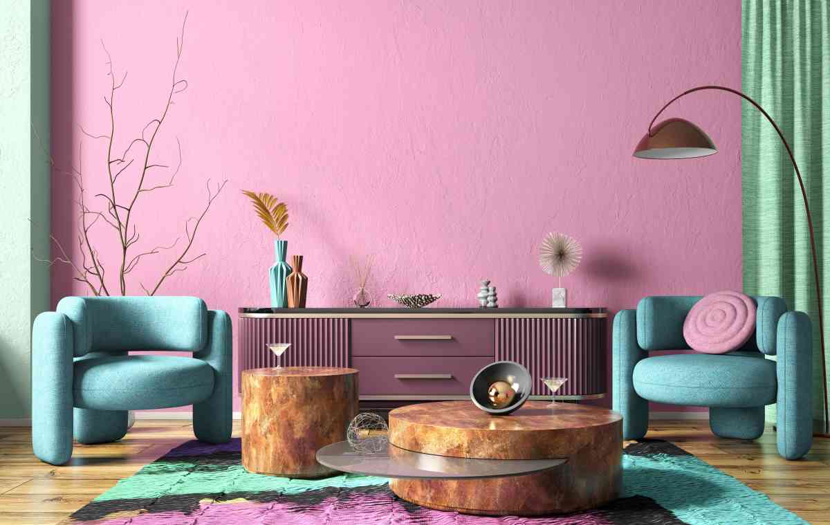 A living room with statement pieces like a purple dresser and teal chairs