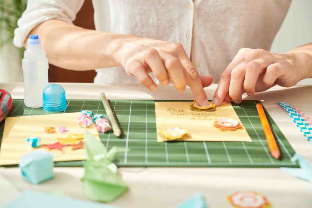 Woman making a card at a craft table