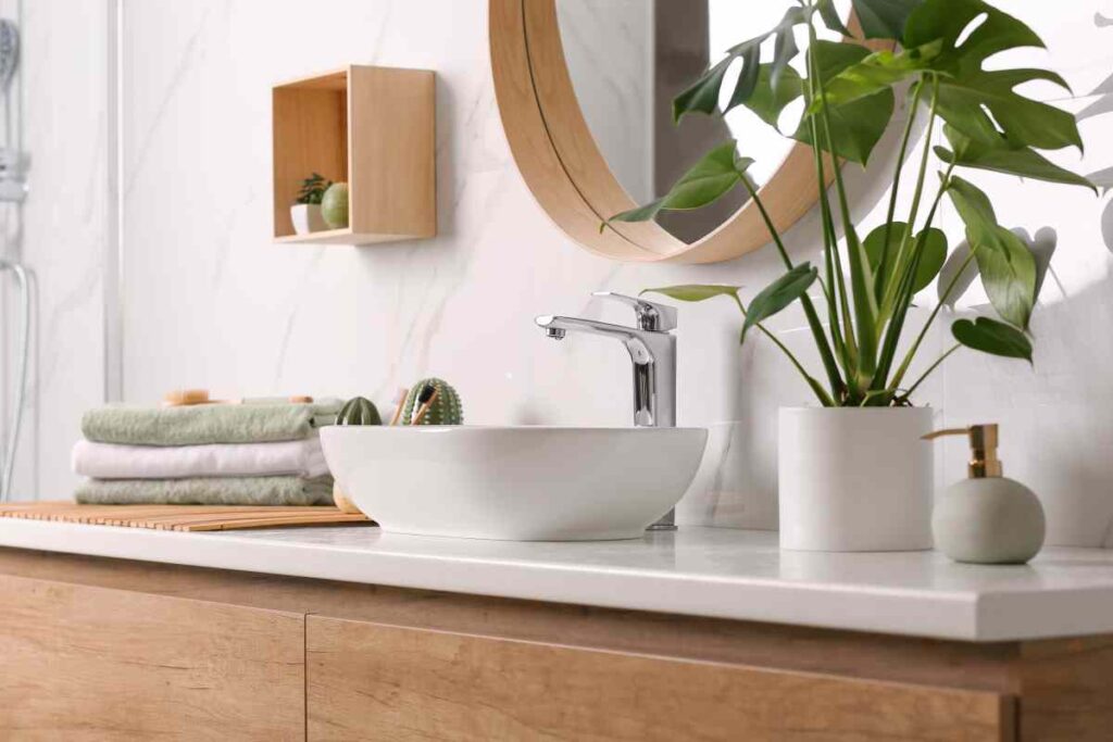 Bathroom counter with towels and plants, bathroom decorating ideas on a budget