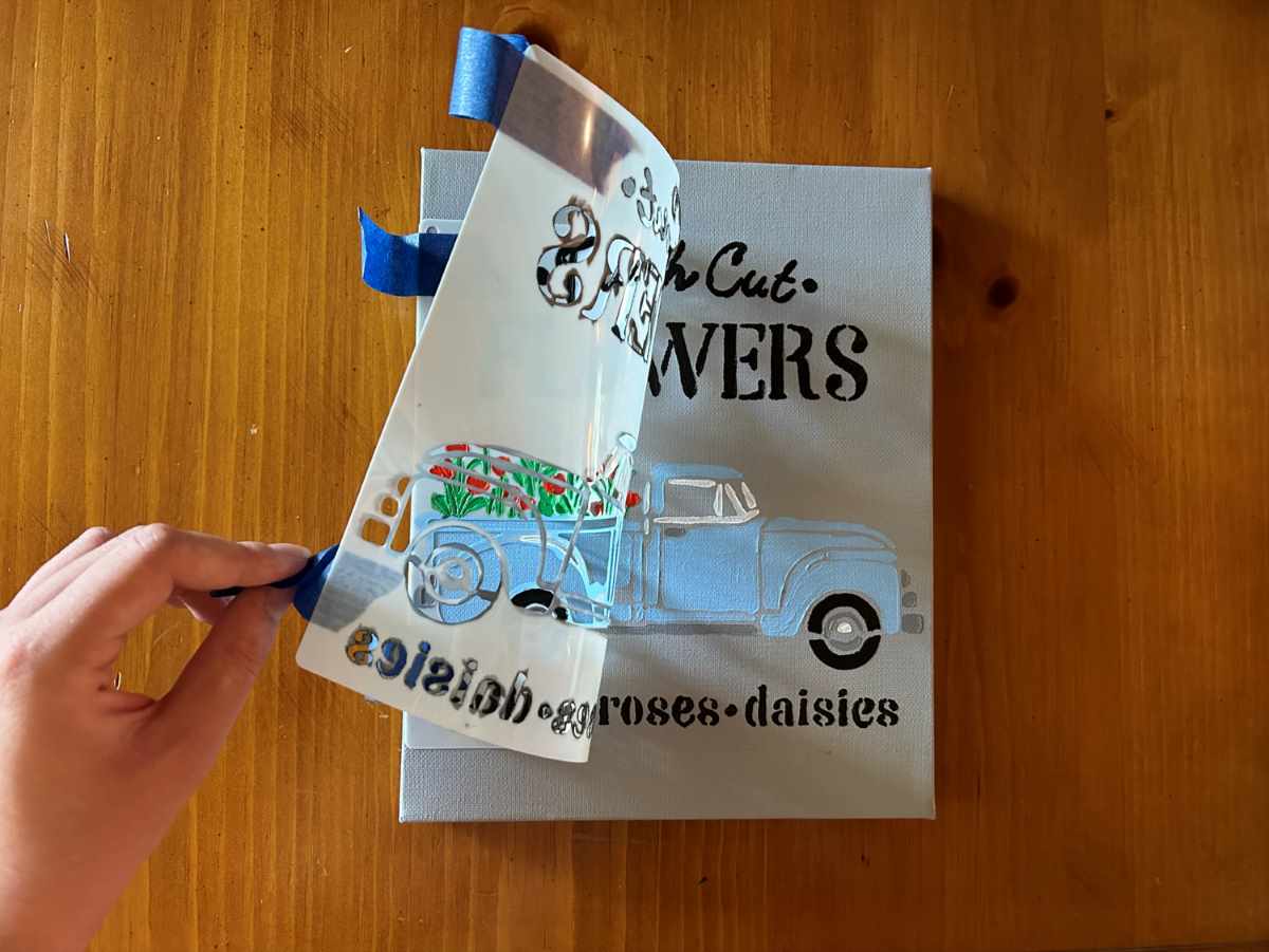 Stenciling a blue farm truck on canvas removing the image