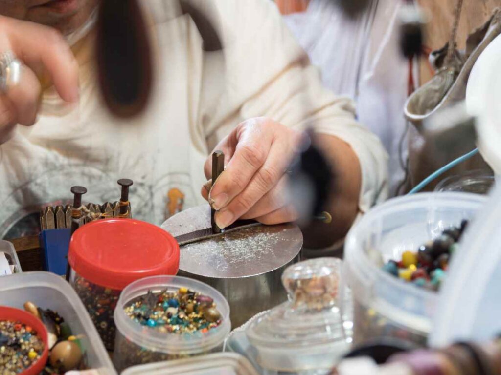 Using a steel block as the base for stamping metal jewelry