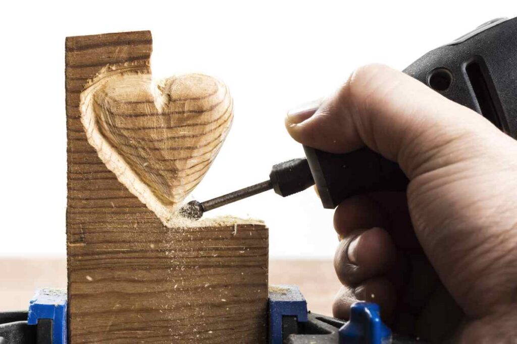 Carving a wooden heart with a rotary tool