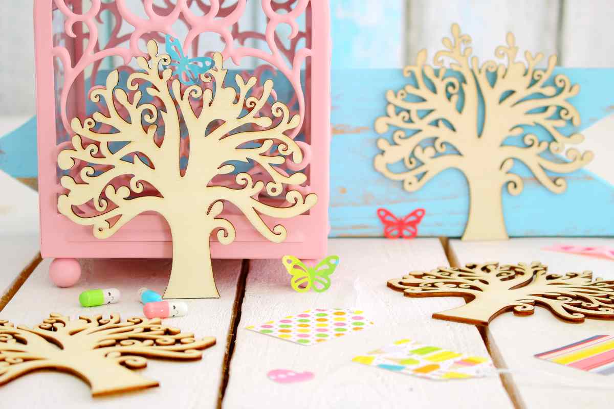 Wooden tree, butterfly, and other craft embellishments made using a wood craft cutting machine