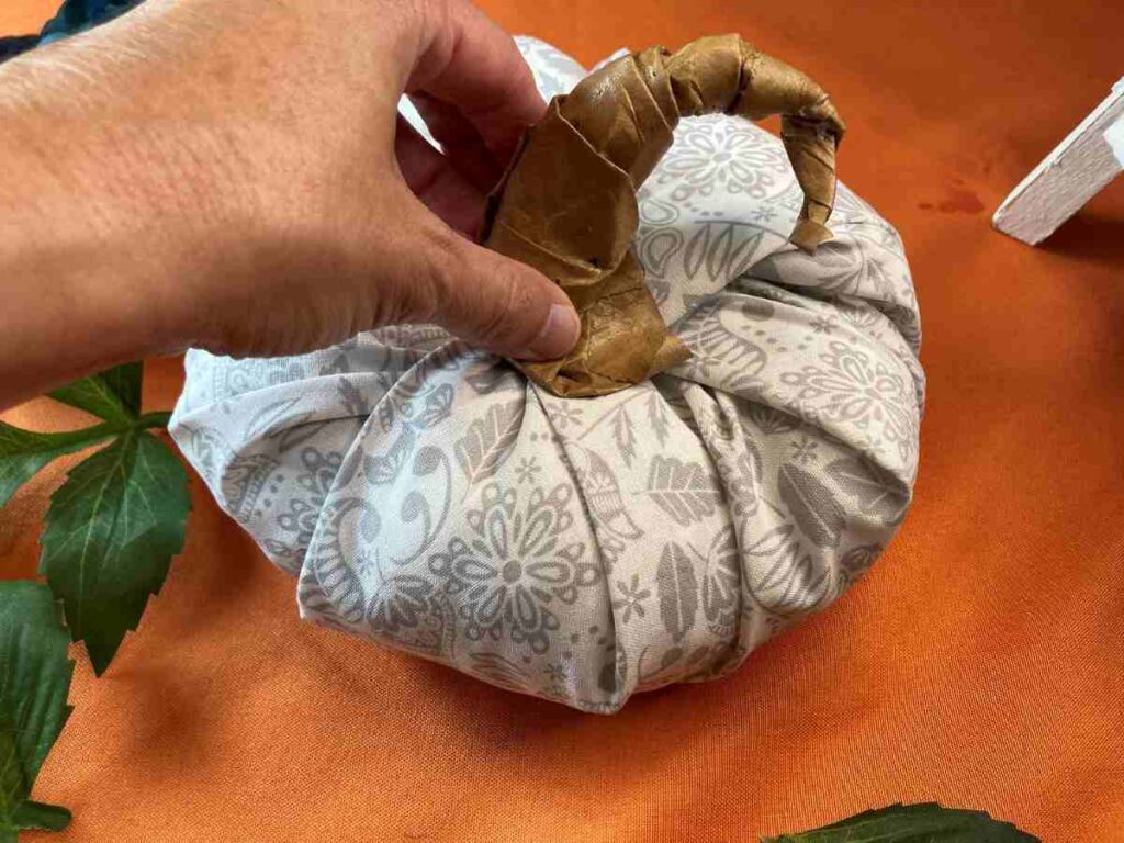 Attaching a paper stem to a fabric pumpkin