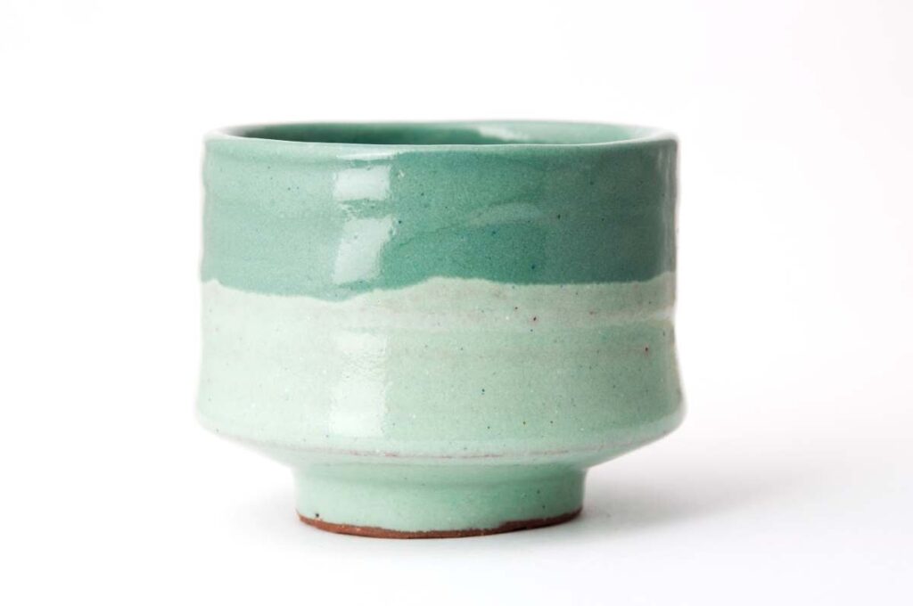 Pottery vase glazed with two shades of green