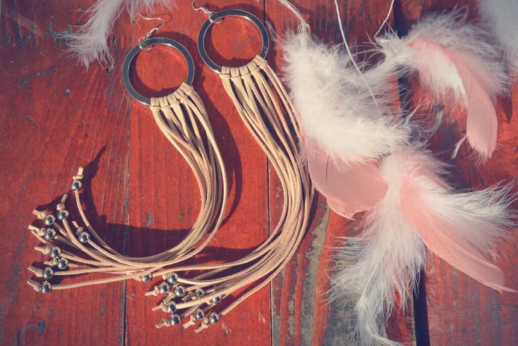 Earrings with long leather tassels on them.