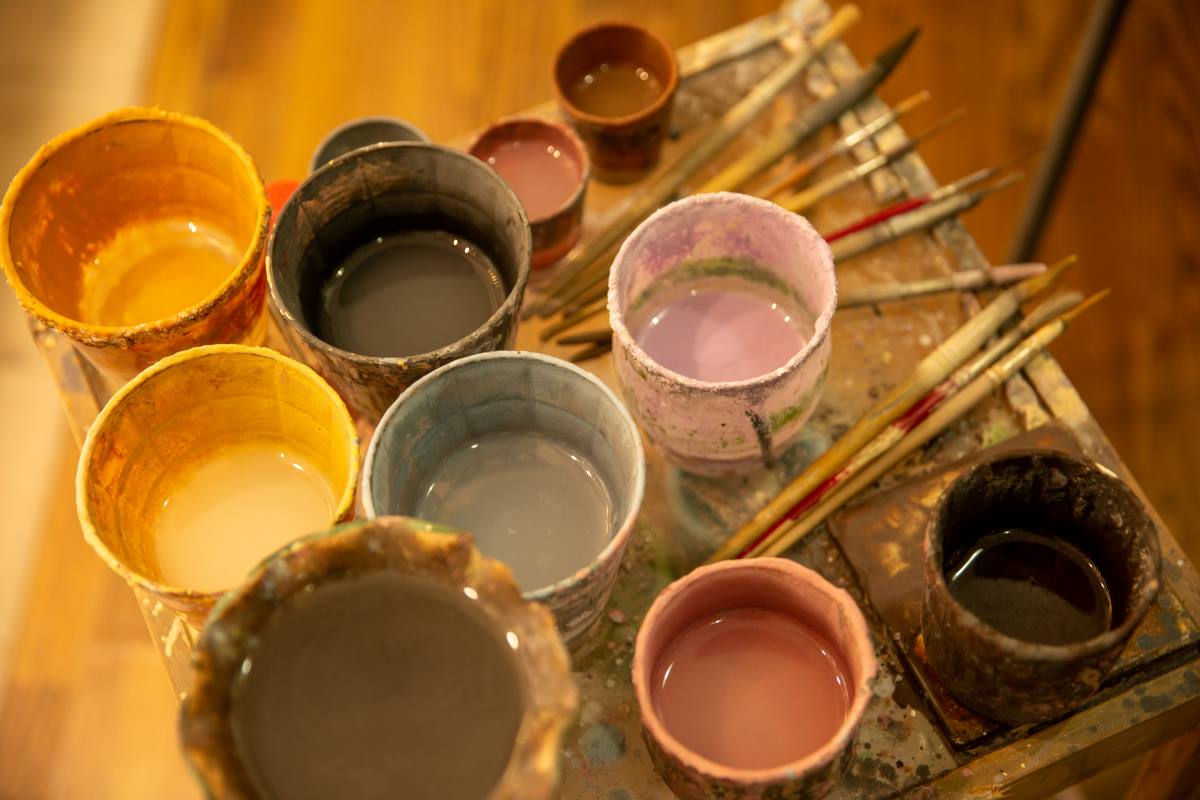 Pots of different colors of glaze for pottery glaze ideas