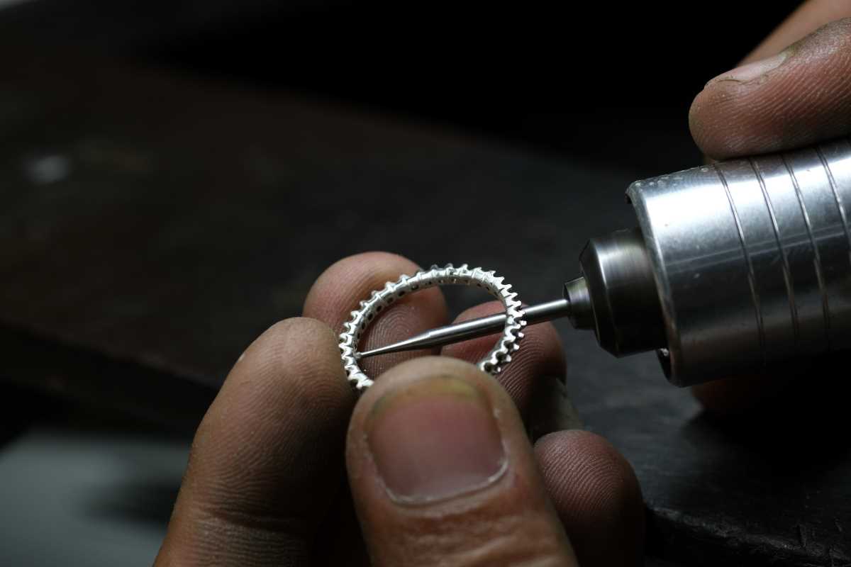 Jeweler using a jewelers drill on a ring