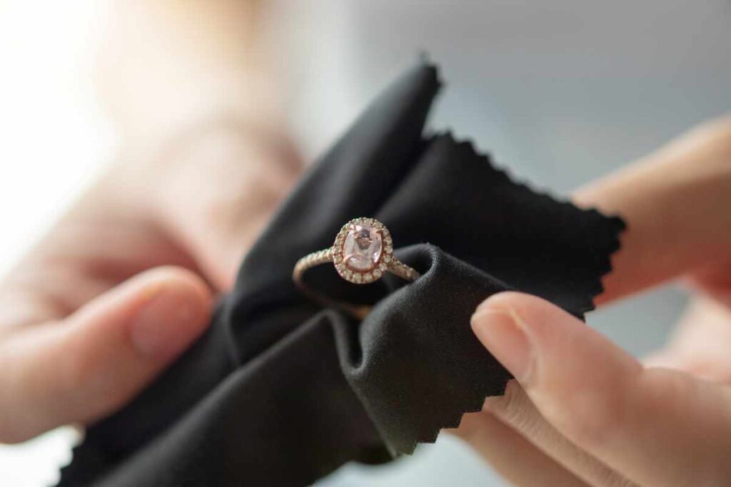 Cleaning a gold-plated ring with a black soft cloth