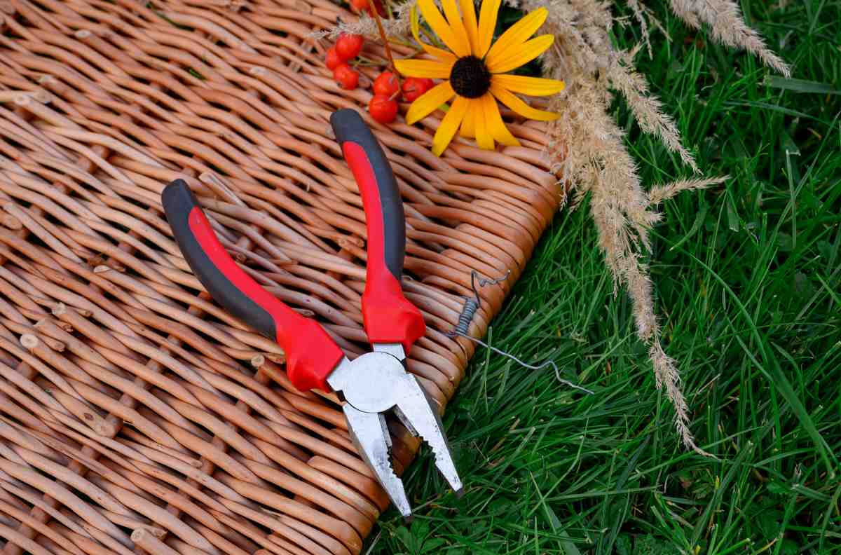 Pair of pliers on a wicker table