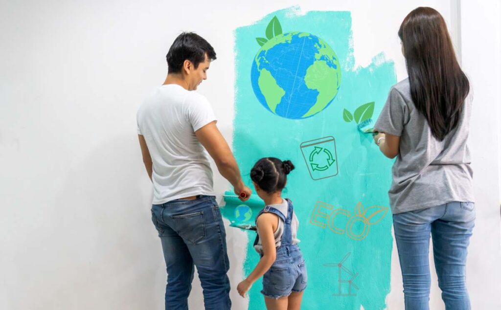 Family painting a wall using eco-friendly paint