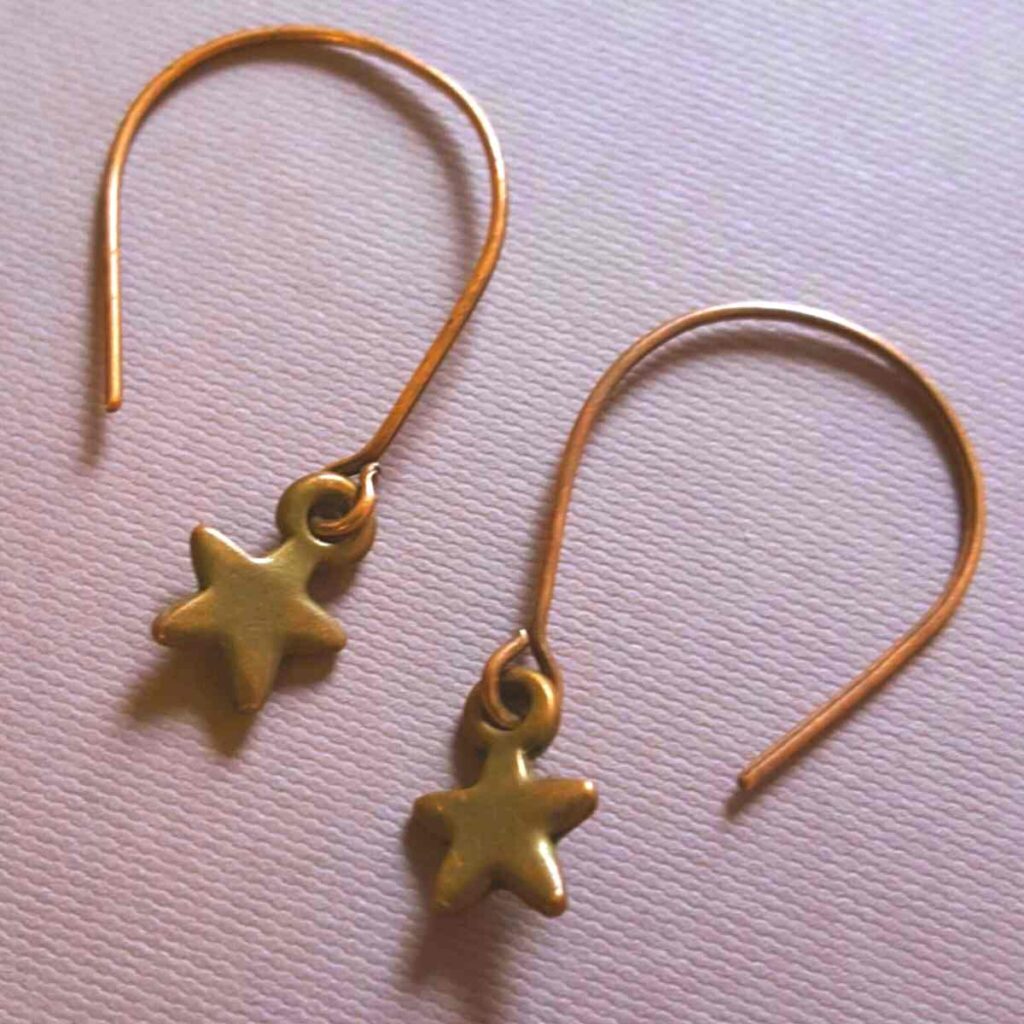 Mixed metal earrings with star charms
