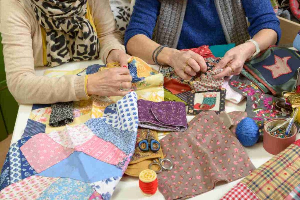 Two women working on quilts