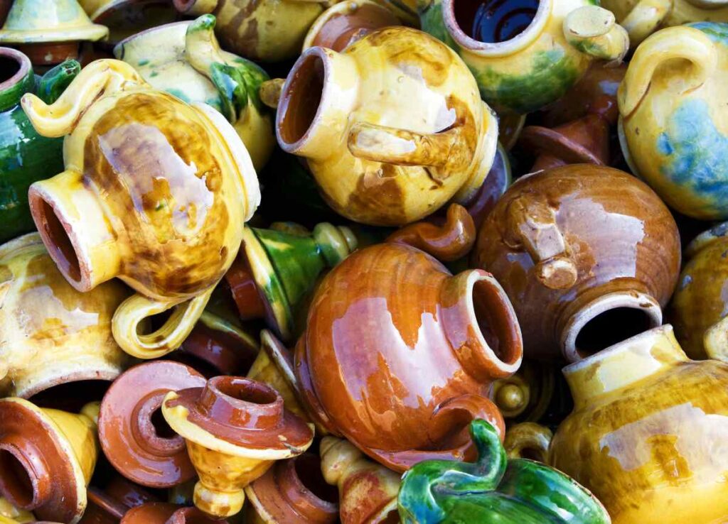 Large group of colorful ceramic teapots
