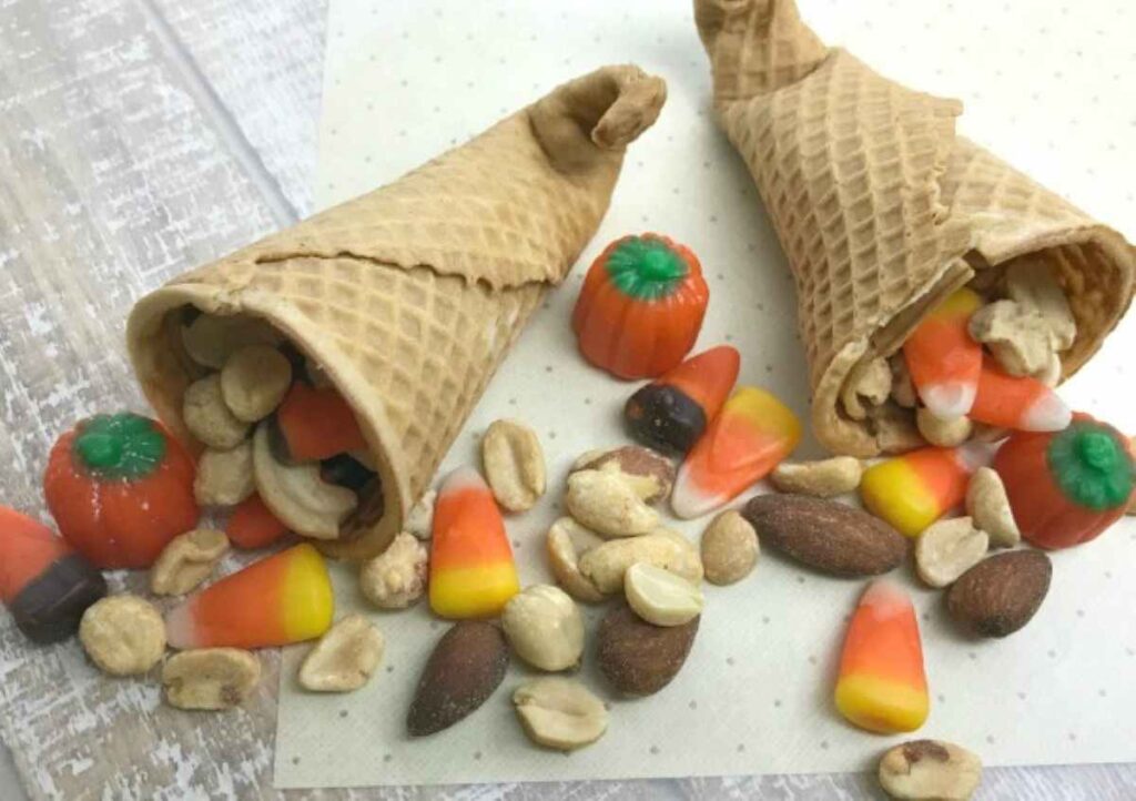 Sugar cone cornucopias filled with nuts and candy