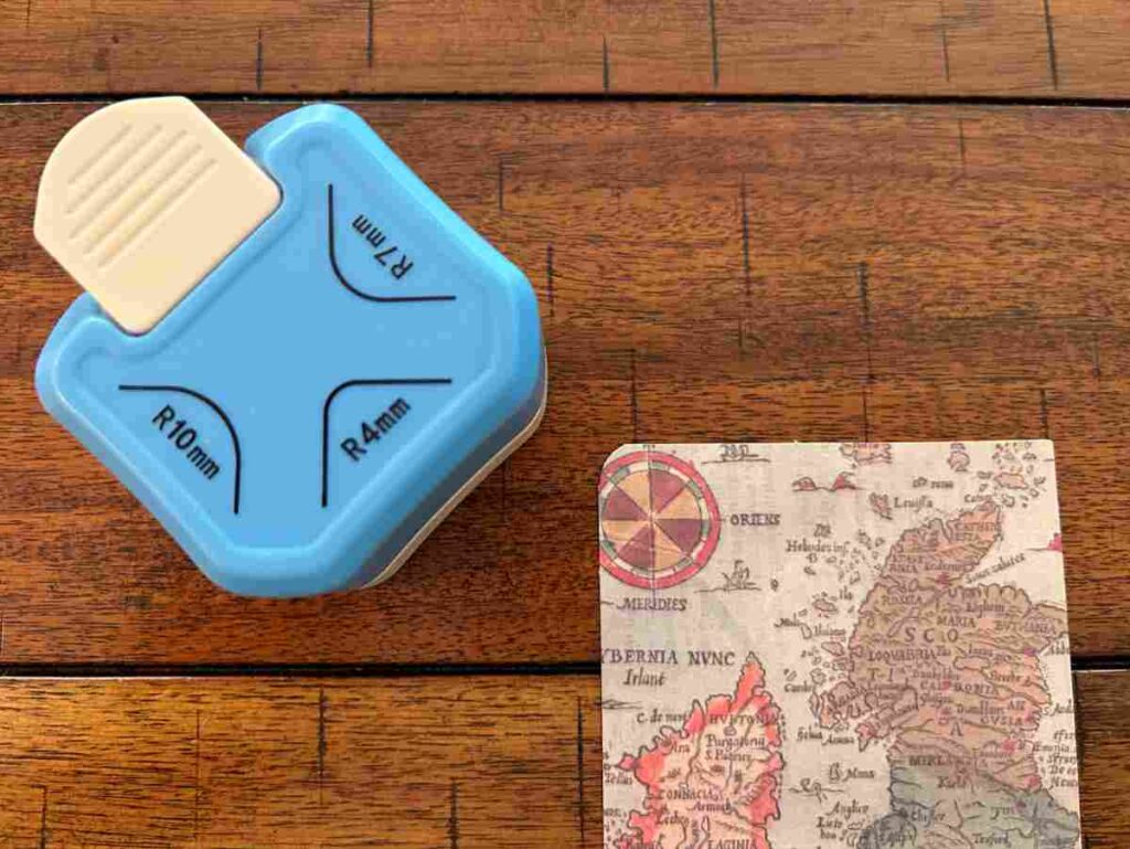 A corner rounder used for scrapbooking and scrapbook paper
