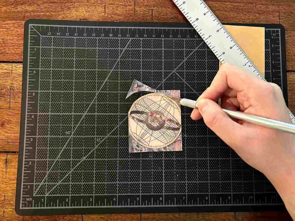 Using a craft knife to cut out detailed images for scrapbooking