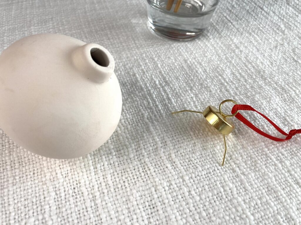 Hanger part of ornament removed in preparation for painting