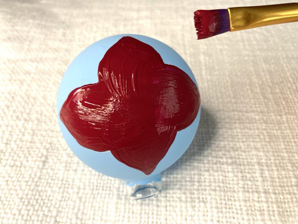 Blue ornament with a red flower