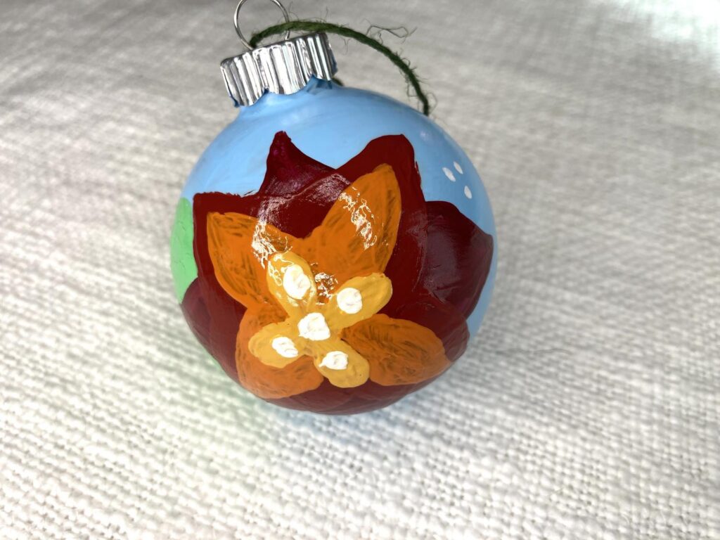 Finished hand painted wooden ornament with flower design