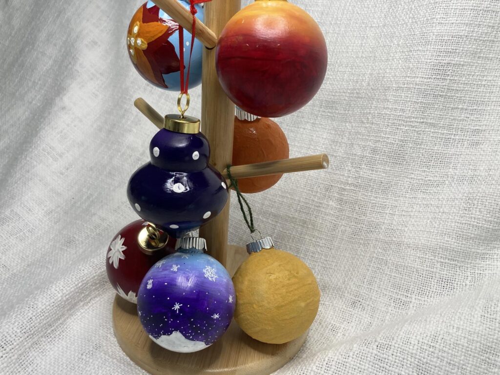A collection of hand painted Christmas ornaments