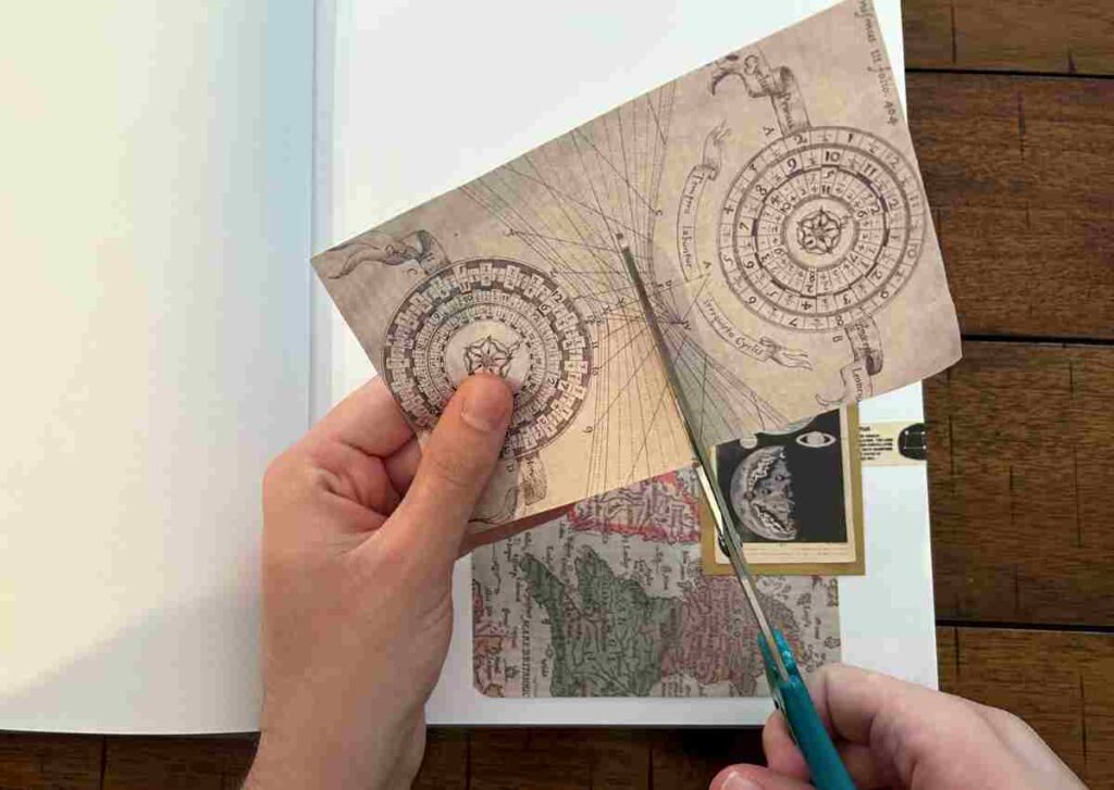 Using a pair of scissors to cut scrapbooking paper