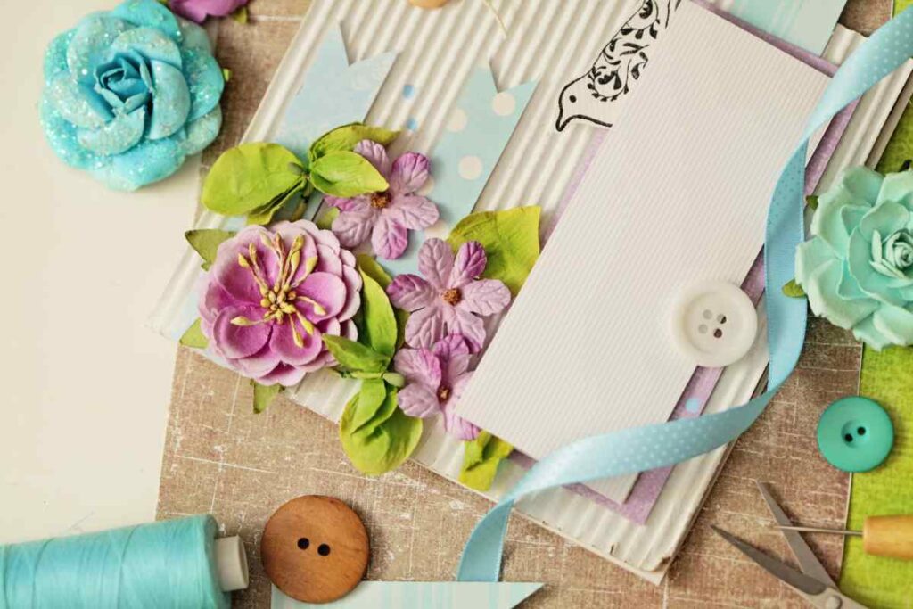 a variety of scrapbooking supplies including ribbons and buttons to be used when learning how to start scrapbooking